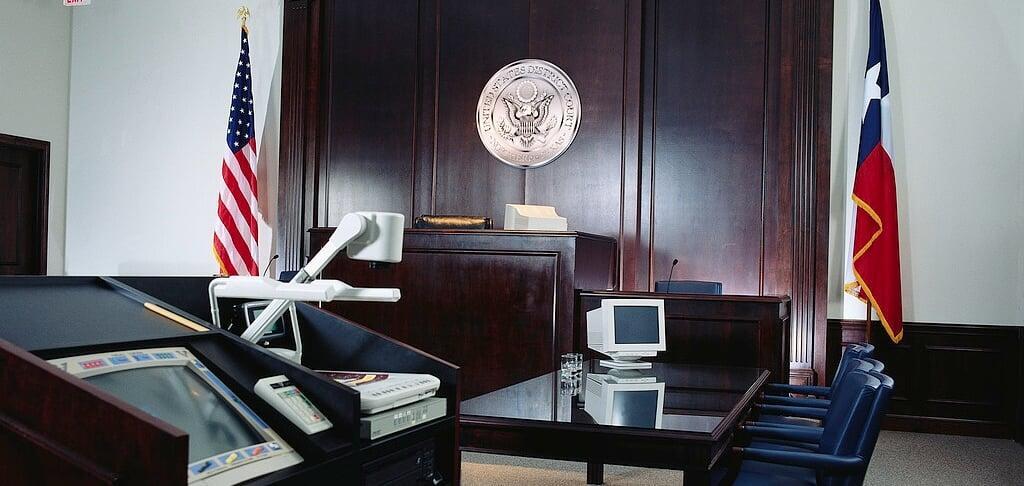 modern U.S. courtroom with judge's bench, U.S. District Court seal