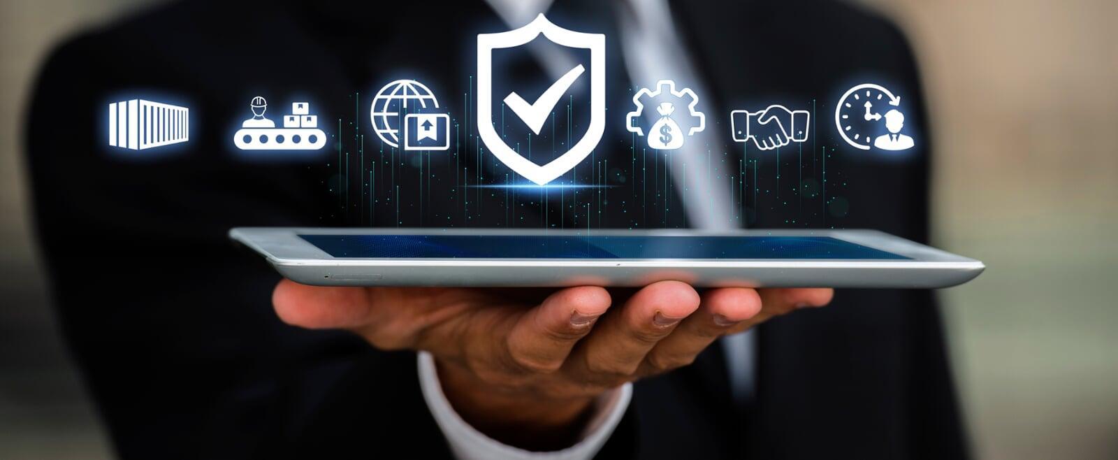 Businessman holding a tablet with floating digital icons representing cybersecurity, logistics, finance, and efficient business solutions.