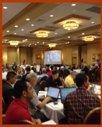 Corporate seminar event with professionals engaged in discussions and learning opportunities for business growth.